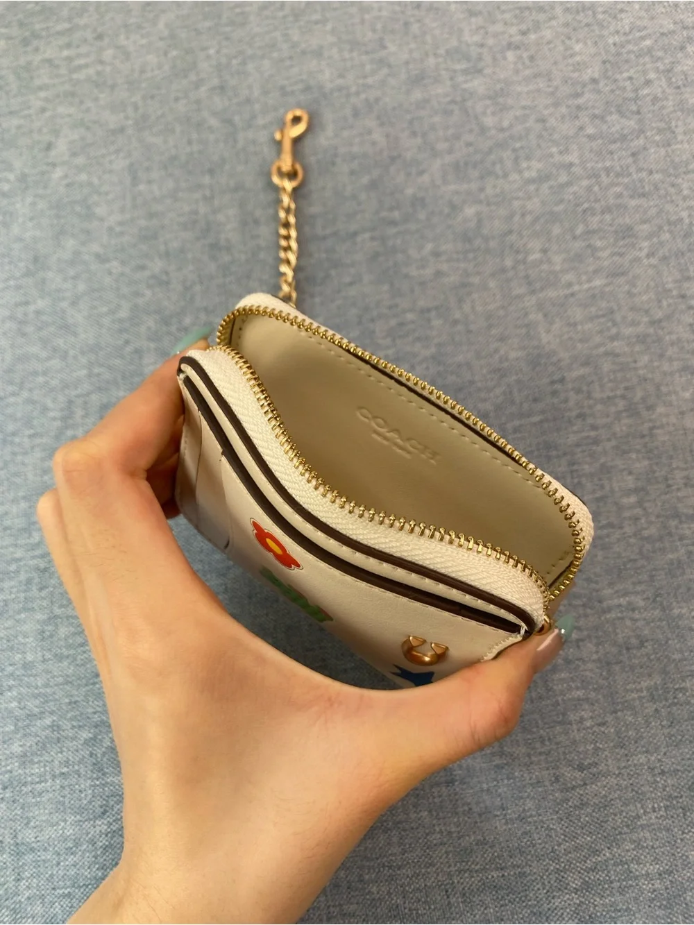 Coach Cream Card Holder with Gold Chain and Playful Charms